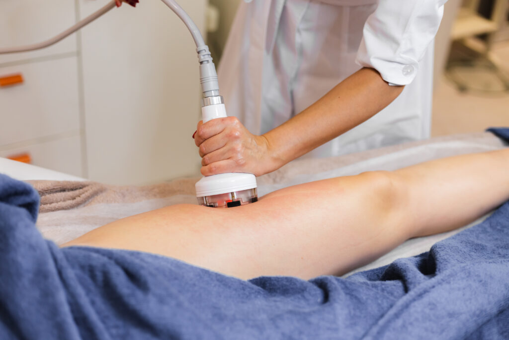 Ultrasonic Cavitation: A Non-Invasive Solution for Weight Loss and Body Sculpting 3 masseur doing anti cellulite massage client spa beauty salon using oil 1